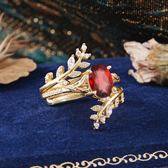 Delicate Leaf Embellished 4 - Prong Oval - Cut Garnet Ring Sets