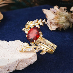 Delicate Leaf Embellished 4 - Prong Oval - Cut Garnet Ring Sets