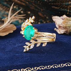 Delicate Leaf Embellished 4 - Prong Oval - Cut Emerald Ring Sets