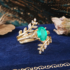 Delicate Leaf Embellished 4 - Prong Oval - Cut Emerald Ring Sets