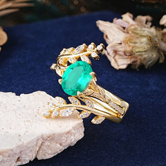 Delicate Leaf Embellished 4 - Prong Oval - Cut Emerald Ring Sets
