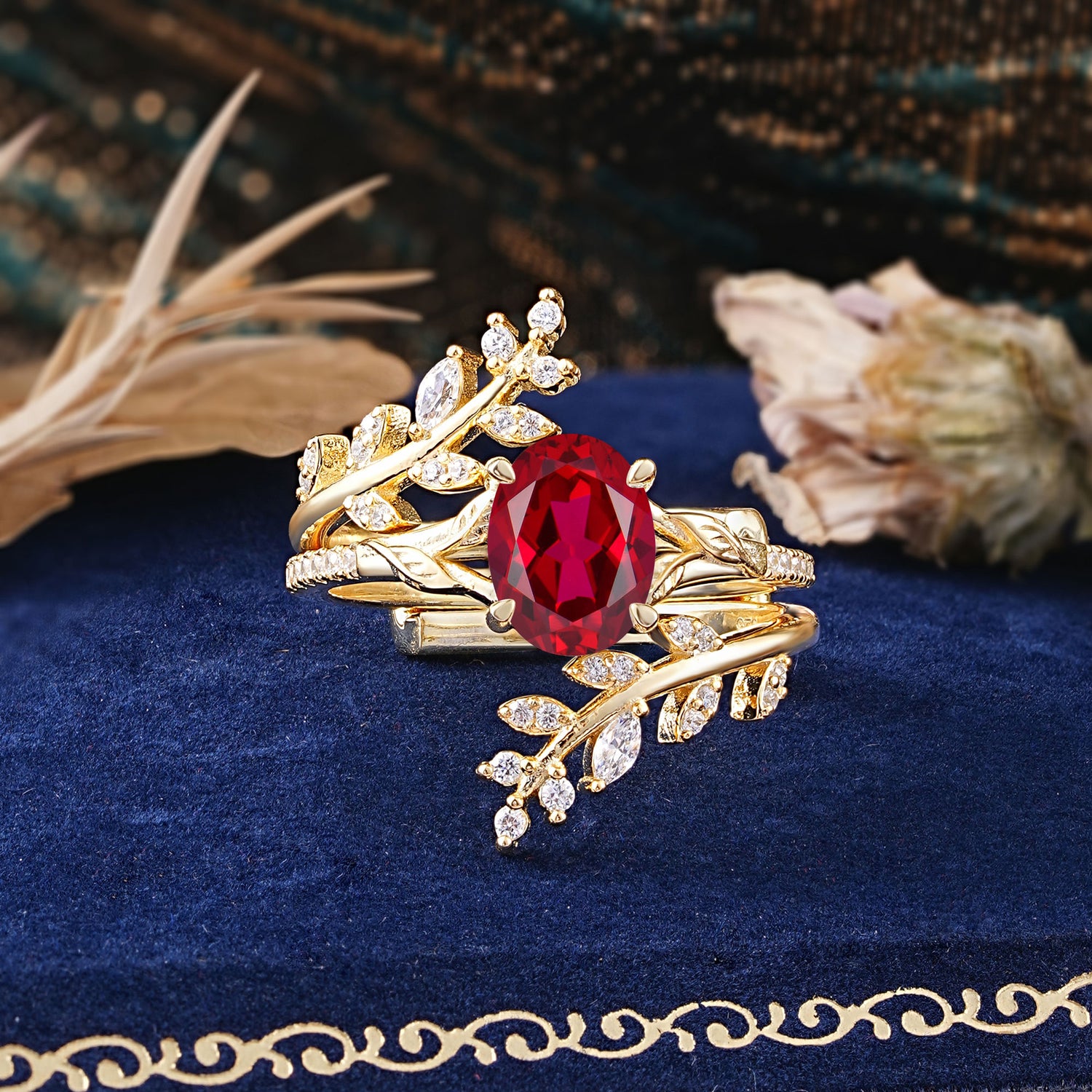 Delicate Leaf Embellished 4 - Prong Oval - Cut Ruby Bridal Ring Set