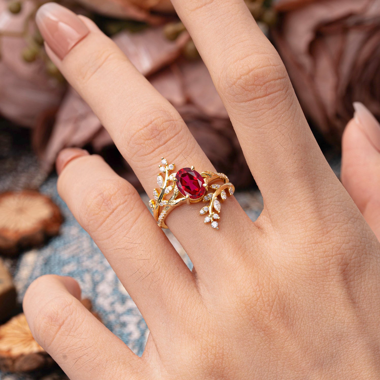 Delicate Leaf Embellished 4 - Prong Oval - Cut Ruby Bridal Ring Set