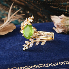 Delicate Leaf Embellished 4 - Prong Oval - Cut Peridot Ring Sets