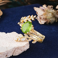 Delicate Leaf Embellished 4 - Prong Oval - Cut Peridot Ring Sets