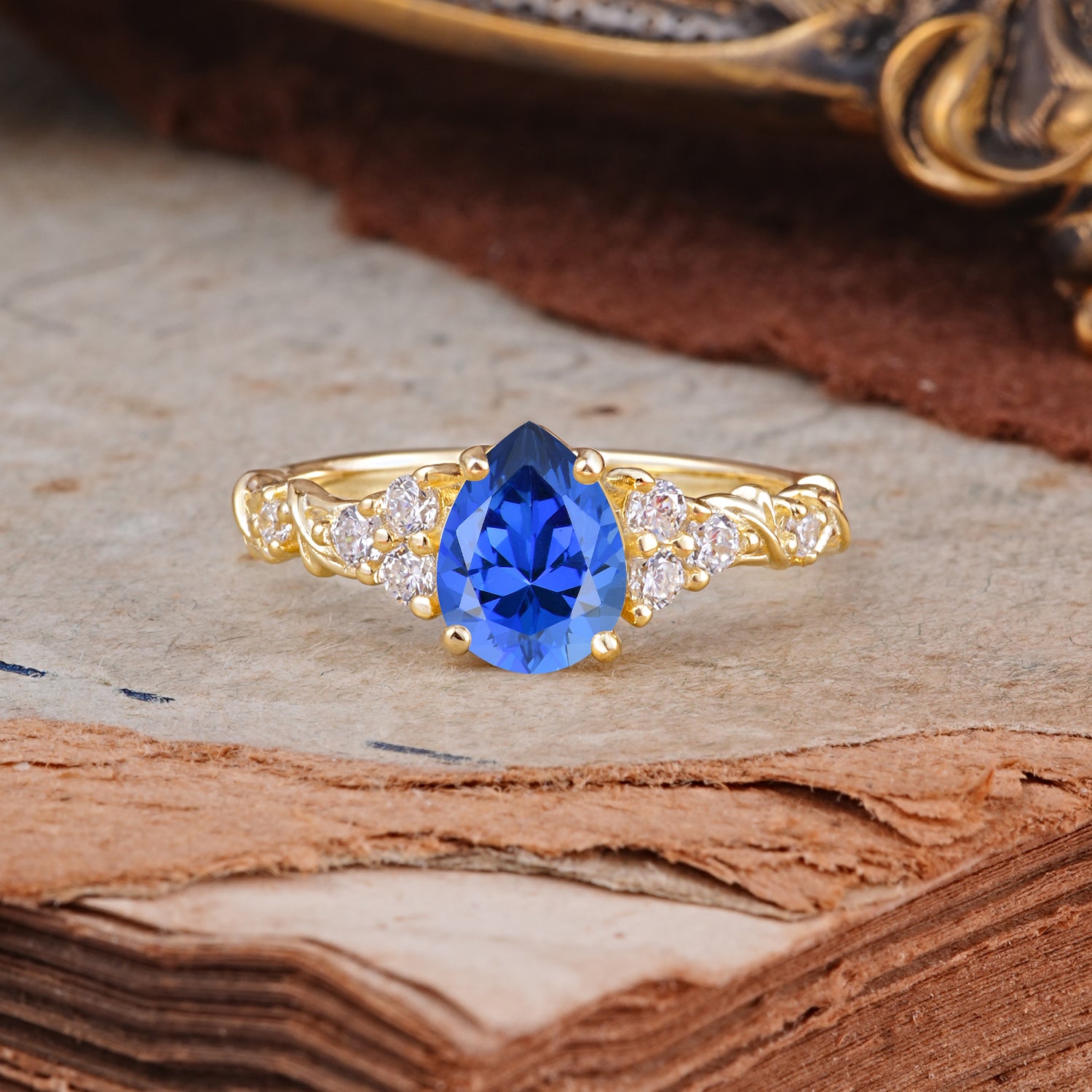 Nature-Inspired Vintage 4-Prong Pear Cut Sapphire Engagement Ring