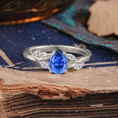 Exquisite 4-Prong Pear Cut Sapphire Engagement Ring