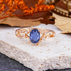 Nature-Inspired Branch-Wrapped 4-Prong Oval Tanzanite Engagement Rings