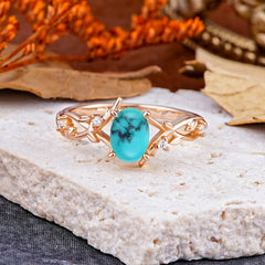 Nature-Inspired Branch-Wrapped 4-Prong Oval Turquoise Engagement Rings