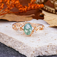 Nature-Inspired Branch-Wrapped 4-Prong Oval Moss Agate Engagement Rings