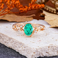 Nature-Inspired Branch-Wrapped 4-Prong Oval Emerald Engagement Rings