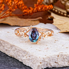 Nature-Inspired Branch-Wrapped 4-Prong Oval Alexandrite Engagement Rings