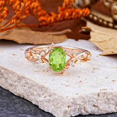 Nature-Inspired Branch-Wrapped 4-Prong Oval Peridot Engagement Rings