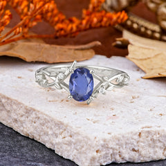 Nature-Inspired Branch-Wrapped 4-Prong Oval Tanzanite Engagement Rings