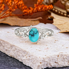 Nature-Inspired Branch-Wrapped 4-Prong Oval Turquoise Engagement Rings