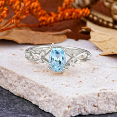 Nature-Inspired Branch-Wrapped 4-Prong Oval Aquamarine Engagement  Rings
