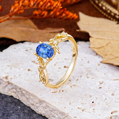 Nature-Inspired Branch-Wrapped 4-Prong Oval Sapphire Engagement Couple Rings