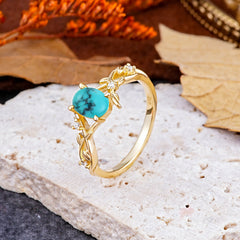 Nature-Inspired Branch-Wrapped 4-Prong Oval Turquoise Engagement Rings