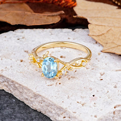 Nature-Inspired Branch-Wrapped 4-Prong Oval Aquamarine Engagement  Rings
