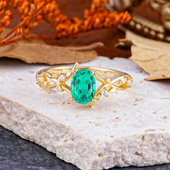 Nature-Inspired Branch-Wrapped 4-Prong Oval Emerald Engagement Rings