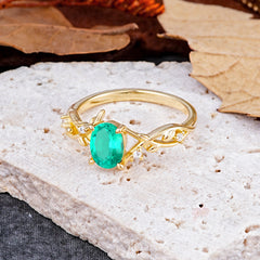 Nature-Inspired Branch-Wrapped 4-Prong Oval Emerald Engagement Rings