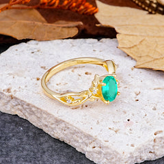 Nature-Inspired Branch-Wrapped 4-Prong Oval Emerald Engagement Rings