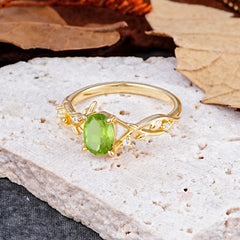Nature-Inspired Branch-Wrapped 4-Prong Oval Peridot Engagement Rings