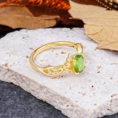 Nature-Inspired Branch-Wrapped 4-Prong Oval Peridot Engagement Rings