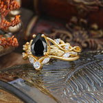 Luxury Nature-Inspired Pear Cut Vintage White 4 Prong Black Onyx Ring Pave Engagement Ring Set displayed on a decorative surface.