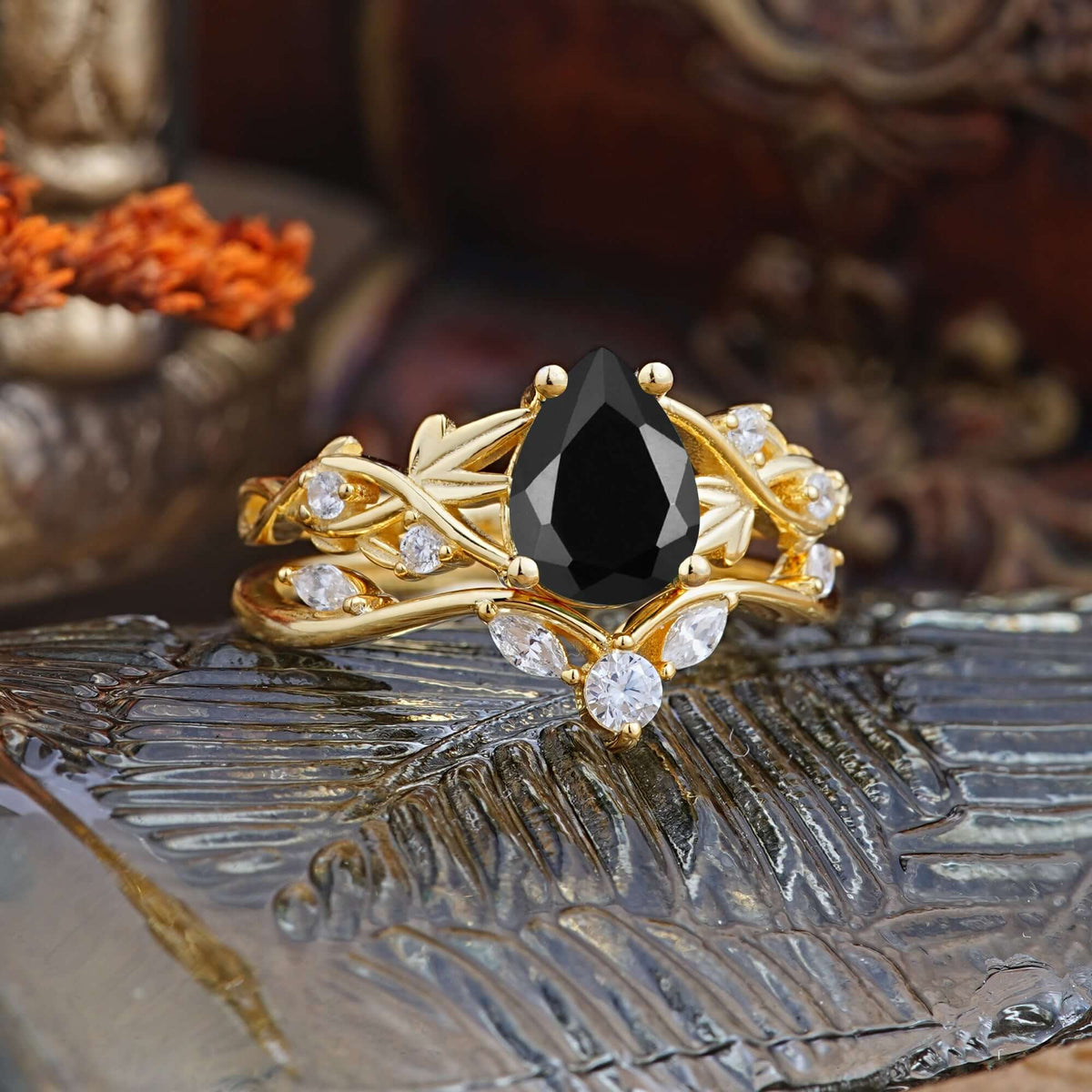 Luxury Nature-Inspired Pear Cut Vintage White 4 Prong Black Onyx Ring Pave Engagement Ring Set on a decorative backdrop.