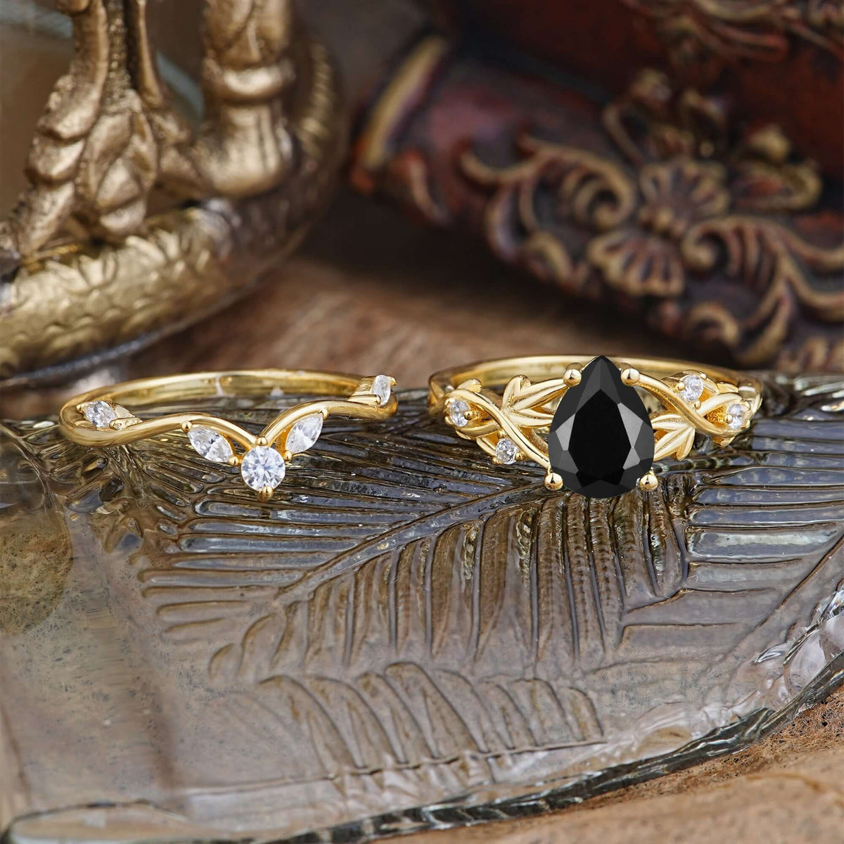 Luxury Nature-Inspired Pear Cut Vintage White 4 Prong Black Onyx Ring Pave Engagement Ring Set on a decorative surface.