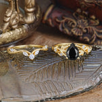 Luxury Nature-Inspired Pear Cut Vintage White 4 Prong Black Onyx Ring Pave Engagement Ring Set on a decorative surface.