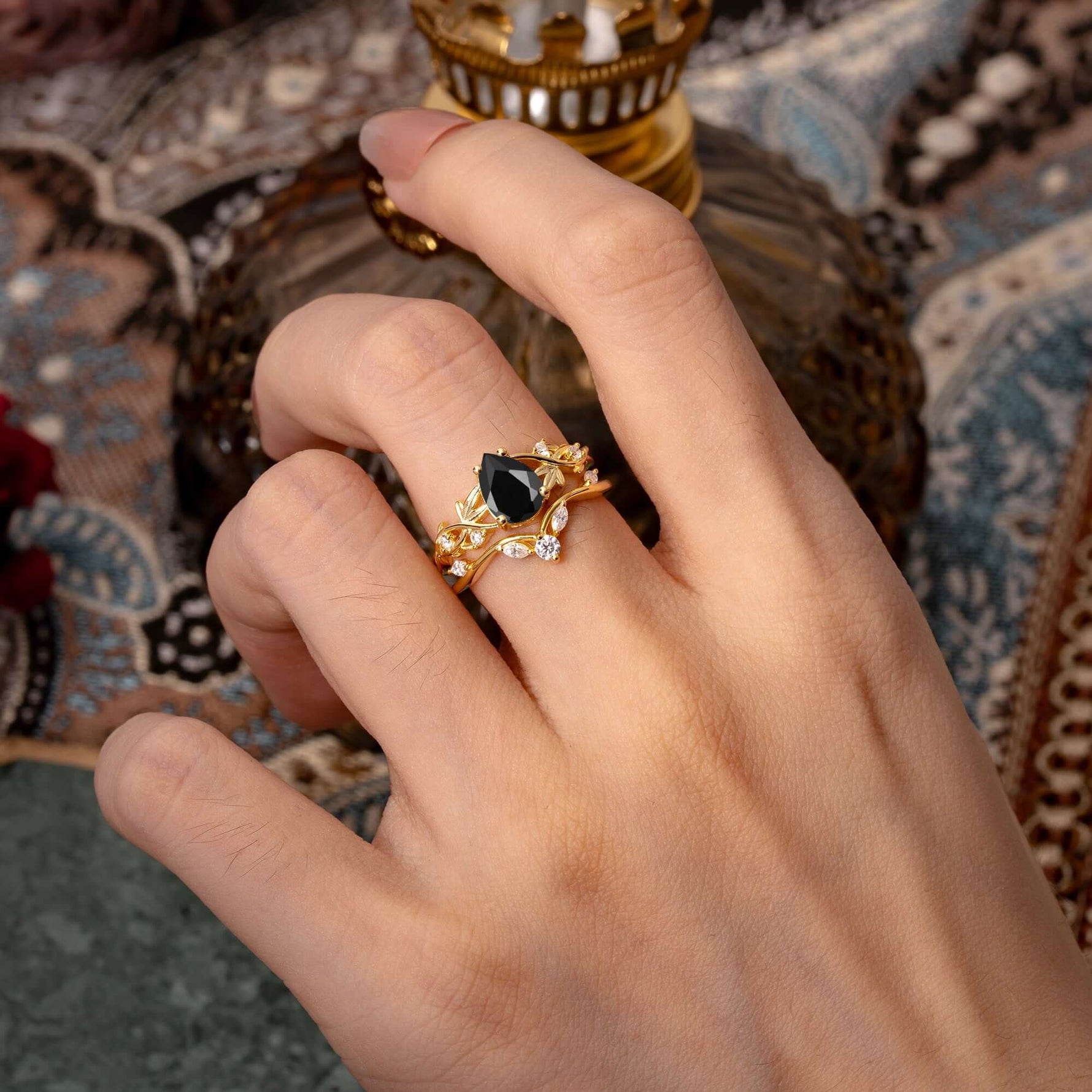 Luxury Nature-Inspired Pear Cut Vintage White 4 Prong Black Onyx Ring Pave Engagement Ring Set worn on hand.