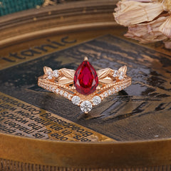Nature-Inspired Pear-Cut Ruby Couple's Engagement Ring Set