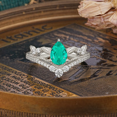 Nature-Inspired Pear-Cut Emerald Couple's Engagement Ring Set