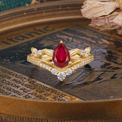 Nature-Inspired Pear-Cut Ruby Couple's Engagement Ring Set