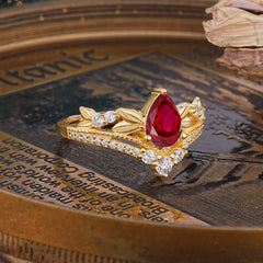 Nature-Inspired Pear-Cut Ruby Couple's Engagement Ring Set