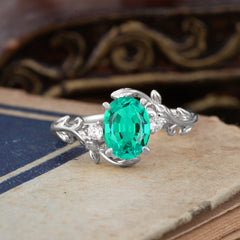 Contemporary Nature-Inspired 4-Prong Oval-Cut Natural Emerald Engagement Ring