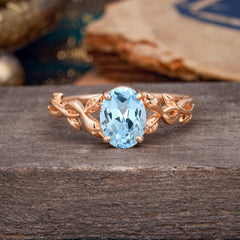 Nature-inspired Botanical Vine Entwined 4-Prong Oval-Cut Aquamarine Engagement Ring
