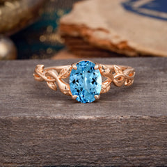 Nature-inspired Botanical Vine Entwined 4-Prong Oval-Cut Aquamarine Engagement Ring