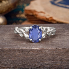 Nature-inspired Botanical Vine Entwined 4-Prong Oval-Cut Tanzanite Engagement Ring