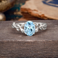 Nature-inspired Botanical Vine Entwined 4-Prong Oval-Cut Aquamarine Engagement Ring