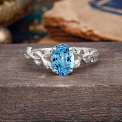 Nature-inspired Botanical Vine Entwined 4-Prong Oval-Cut Aquamarine Engagement Ring