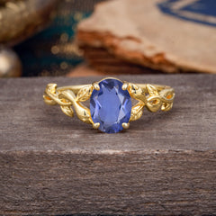 Nature-inspired Botanical Vine Entwined 4-Prong Oval-Cut Tanzanite Engagement Ring