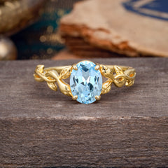 Nature-inspired Botanical Vine Entwined 4-Prong Oval-Cut Aquamarine Engagement Ring