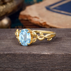 Nature-inspired Botanical Vine Entwined 4-Prong Oval-Cut Aquamarine Engagement Ring