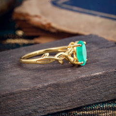 Nature-inspired Botanical Vine Entwined 4-Prong Oval-Cut Emerald Engagement Ring