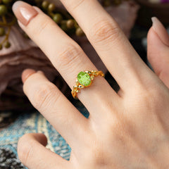 Nature-inspired Botanical Vine Entwined 4-Prong Oval-Cut Peridot Engagement Ring