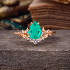 Nature and Moon-Inspired 4-Prong Pear-Cut Emerald Engagement Ring