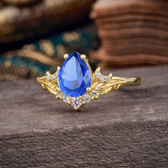 Nature and Moon-Inspired 4-Prong Pear-Cut Sapphire Engagement Ring
